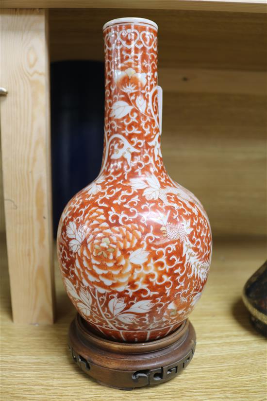 A late/early 19th century Chinese coral red phoenix vase height 29cm incl. carved stand